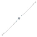 Elegant silver bracelet with deep blue gemstones and clear diamond accents on white background